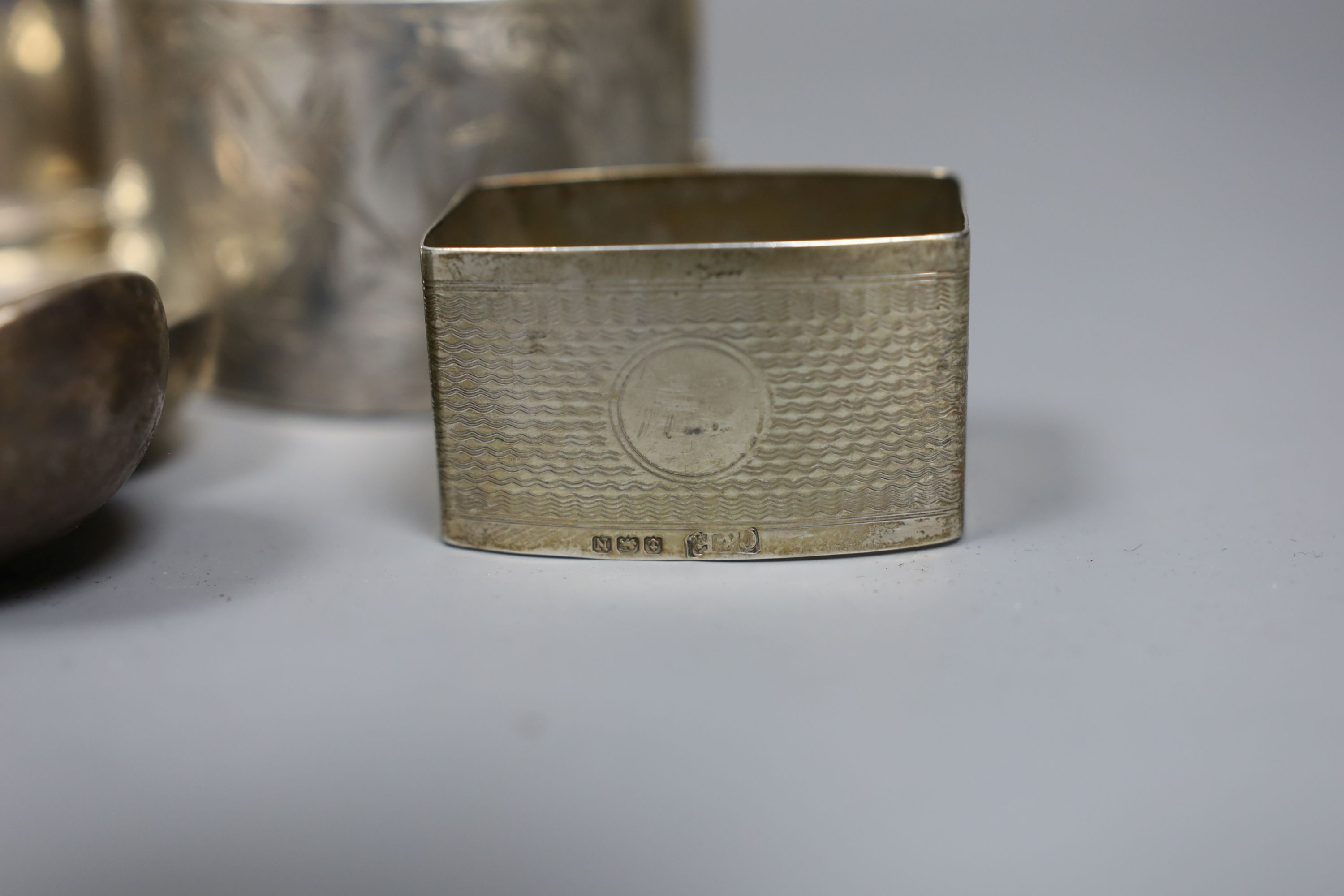 Assorted small silver including flatware, napkin rings, tortoiseshell mounted inkwell, two coins and a Georg Jensen sterling preserve spoon, no. 41.